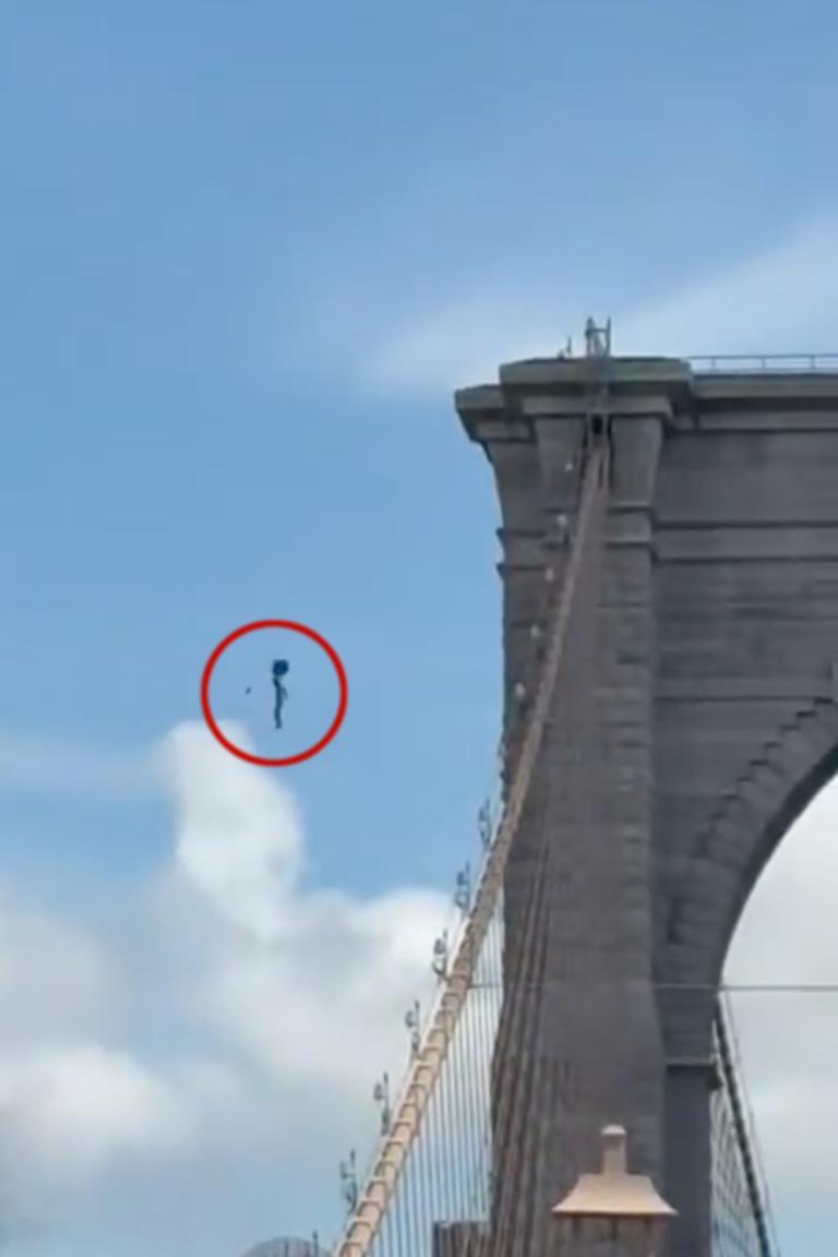 Naked man jumps from Brooklyn Bridge after planting flags